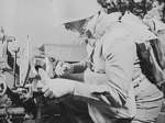 Loading a shell into a 37 mm Gun M3 during a training exercise, Fort Benning, Georgia, United States, Apr 1942