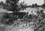 Chinese soldiers firing a 75mm M1 howitzer during a training exercise, India, circa 1942