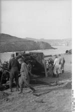 German Army 8.8 cm FlaK 36 gun being mounted onto its carriage, southern France, 1942, photo 1 of 3