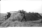 German soldier preparing a shell for an 8.8 cm FlaK gun, Russia, 1942, photo 2 of 2