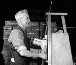 Worker with a newly completed Bren gun at the John Inglis and Company factory, Toronto, Canada, 1940s