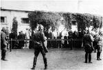 Polish civilians being rounded up in Warsaw, Poland, 1942; the building in the background later became Spanish Embassy on Mysliwiecka Street