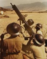 Chinese soldiers posing with a Type 24 machine gun in an anti-aircraft setup, China, circa 1940s, photo 2 of 2