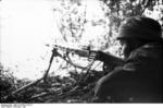 German paratrooper with MG42 machine gun, France, 21 Jun 1944, photo 1 of 5