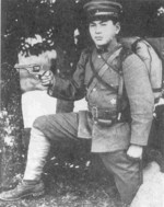 Japanese Army Private 2nd Class posing with a Type 26 revolver, circa 1940s