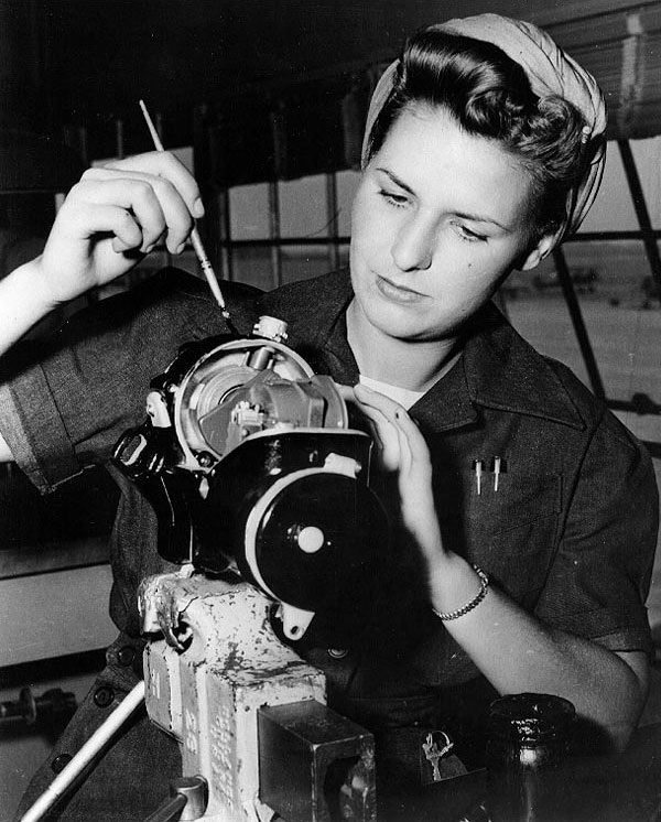 WAVES Aviation Machinist's Mate 3rd Class Dorothy Wuestner applying a paint brush to a magneto, Naval Air Station, Los Alamitos, California, United States, Sep 1943