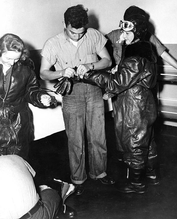 WAVES personnel putting on leather flight gear in preparation of a flight simulation,  Naval Air Station, Jacksonville, Florida, United States, 15 Oct 1943