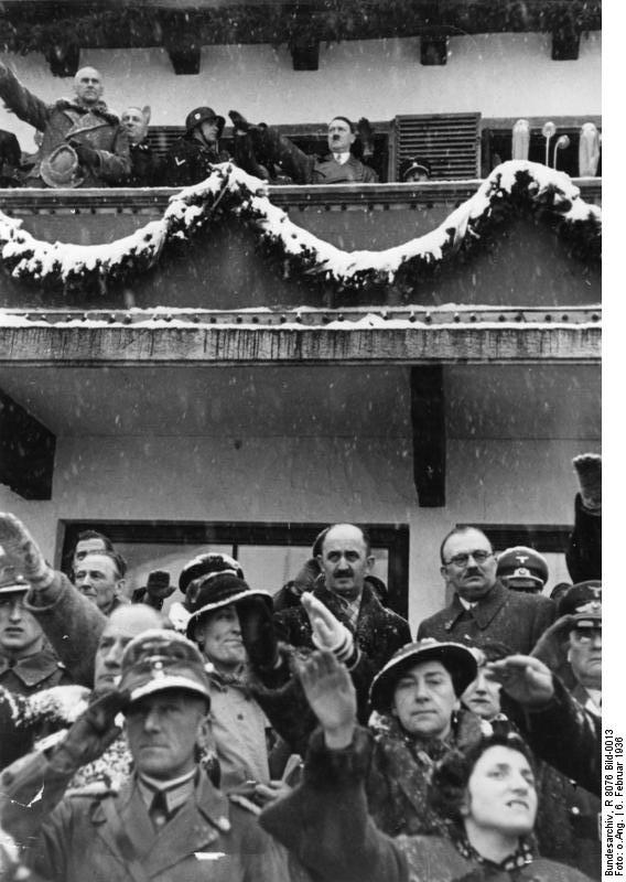 Chancellor Hitler saluting the athletes from balcony of the Olympic House during opening ceremony of the IV Olympic Winter Games, Garmisch-Partenkirchen, Bavaria, Germany, 6 Feb 1936, photo 3 of 4