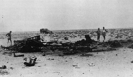 Wreckage of Hans-Joachim Marseille's Bf 109G-6 fighter south of Sidi Abdel Rahman, Egypt, 30 Sep 1942; the vehicle in background marked the approximate location where Marseille's body landed