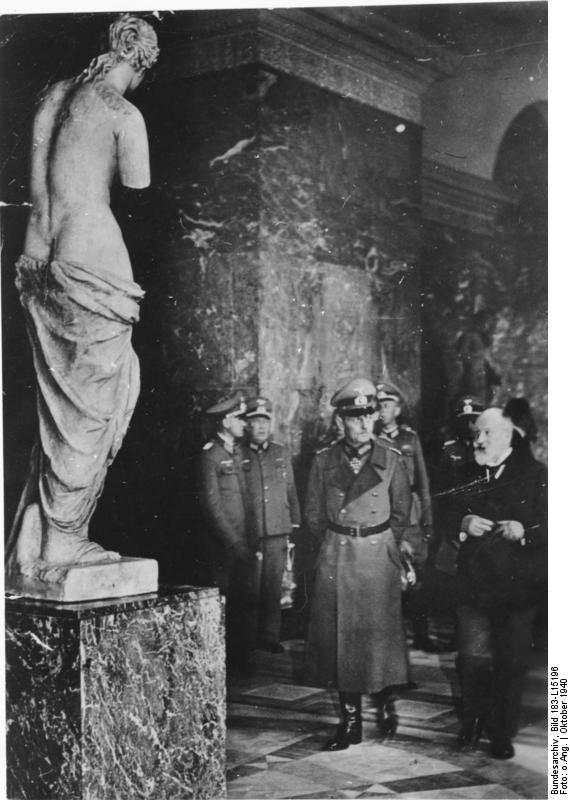 Curator of the Louvre Fernand Merlin giving German Field Marshal Gerd von Rundstedt a tour of the museum, Paris, France, Oct 1940; note Venus de Milo status in foreground