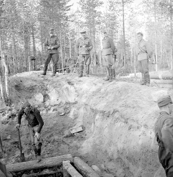 Finnish General Hjalmar Siilasvuo (with walking stick) inspecting the construction of defensive fortifications in Finland, 1940s