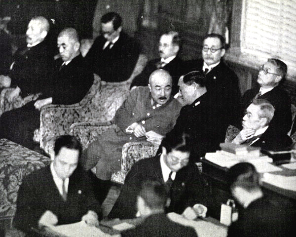 Japanese War Minister Seoshiro Itagaki and Naval Minister Mitsumasa Yonai in discussion at a Budget Committee session, Tokyo, Japan, Jan-Feb 1939; to Yonai's left at the right edge of the photograph is Prime Minister Kiichiro Hiranuma