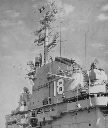 Superstructure of USS Wasp while off Taiwan, 10 Jan 1954; note Republic of China naval ensign for the occasion of visit by Chiang Kaishek