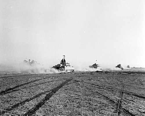 Crusader tanks moving toward the front lines during the Second Battle of El Alamein, 24 Oct 1942