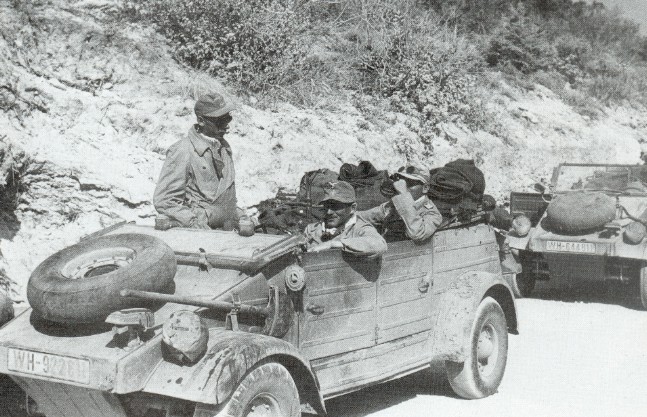 Kübelwagen vehicles of the German Afrikakorps operating in desert conditions, 1940-1943, photo 1 of 3; note the oversize tires that offered better performance on soft surfaces like sand