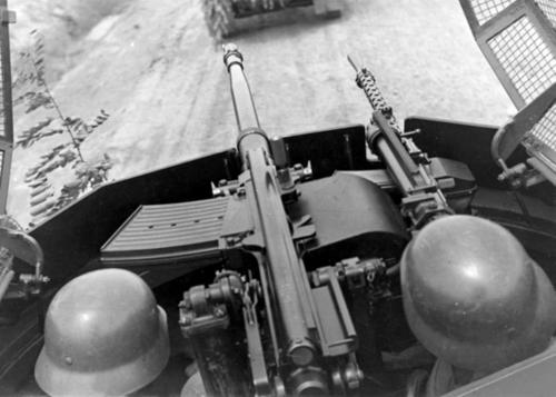 Chinese troops aboard a German-made SdKfz. 221 armored car with a MG 35 machine gun and an anti-tank gun, China, circa late 1930s