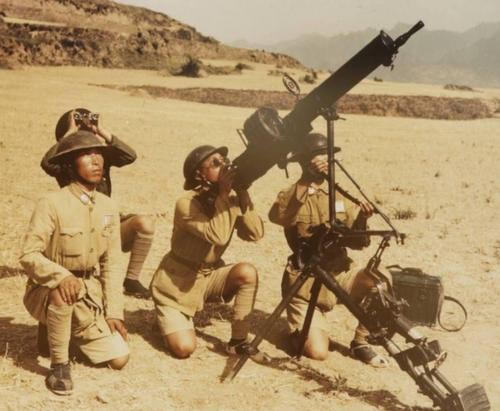 Chinese soldiers posing with a Type 24 machine gun in an anti-aircraft setup, China, circa 1940s, photo 1 of 2