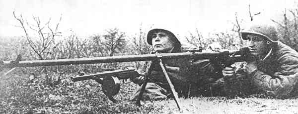 PTRD-41 anti-tank rifle and crew, circa 1940s; note the assistant gunner's PPSh-41 submachine gun