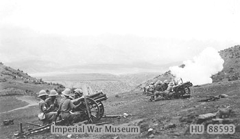 Indian 3.7 inch mountain gun firing, India, circa 1930; this crew was commanded by Sergeant Harry Ewin of No.11 Light Battery, British Royal Artillery