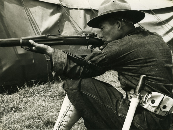 Japanese-American recruit learning how to use the Springfield M1903 rifle, US Territory of Hawaii, date unknown