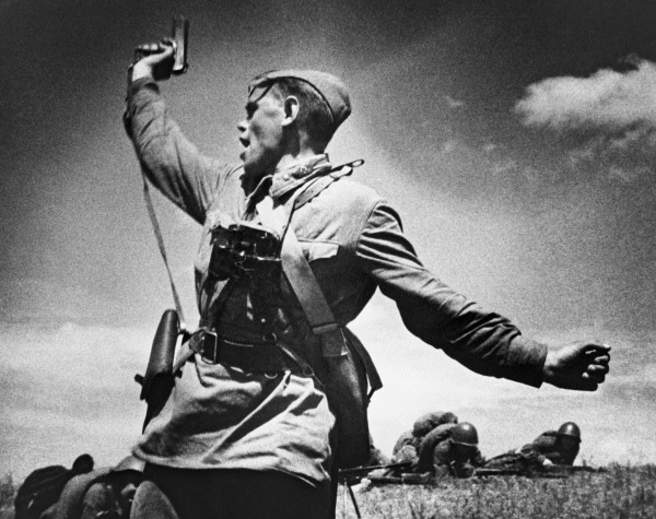 Soviet lieutenant (possibly A. G. Yeremenko of 220th Rifle Regiment of Soviet 4th Rifle Division) waving a TT-33 pistol, Voroshilovgrad region, Ukraine, 12 Jul 1942